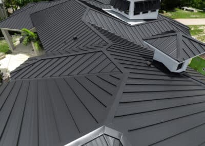 2-inch mechanical lock matte black metal roof on a modern residential home