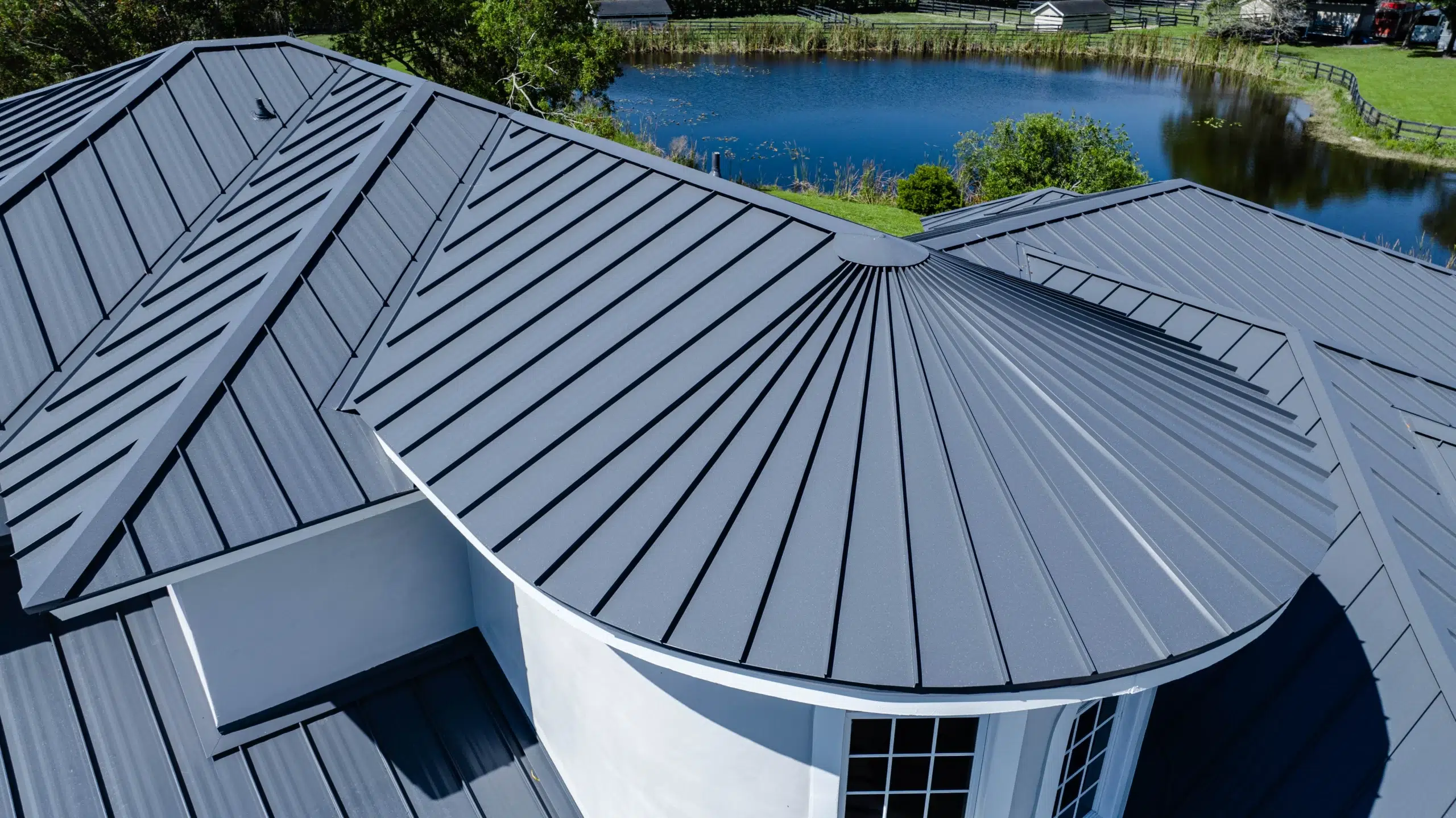 Dove Grey 2" Mechanical Metal Roof – Premium Residential Roofing Residential home featuring a dove grey 2" mechanical metal roof