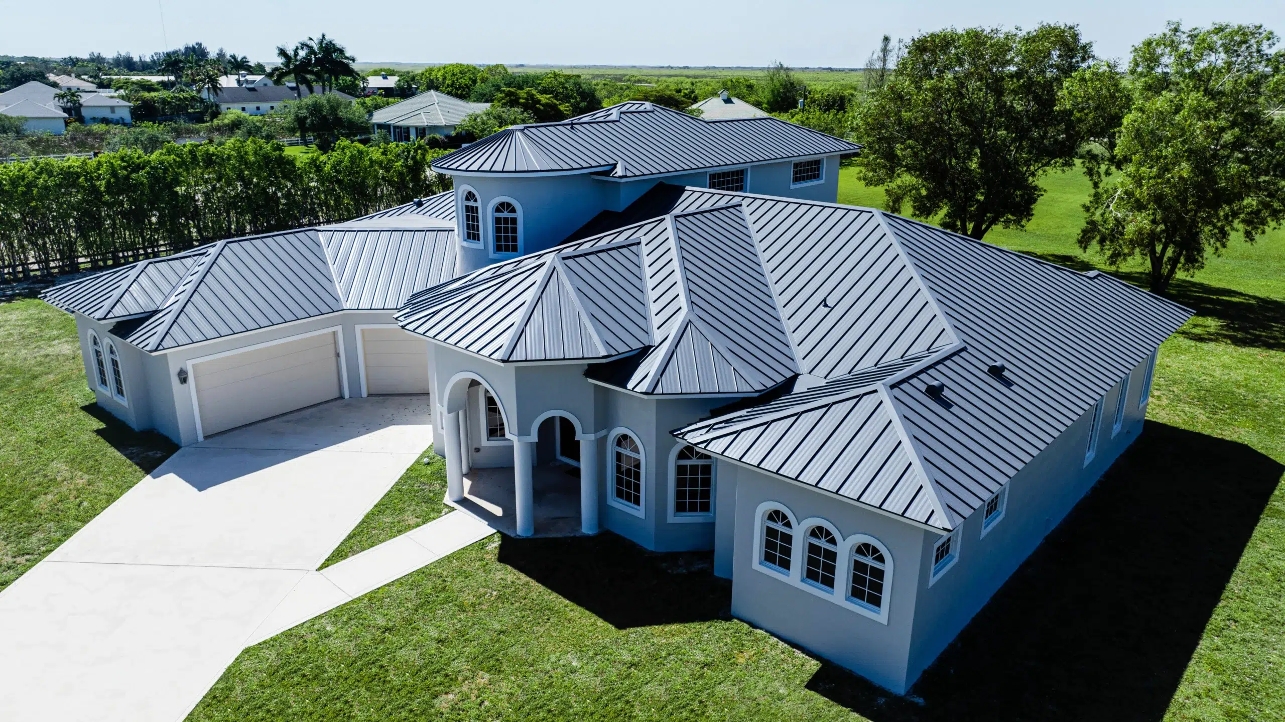 2" Mechanical Metal Roof in Dove Grey – Durable & Elegant Dove grey 2" mechanical metal roof installed on a residential home